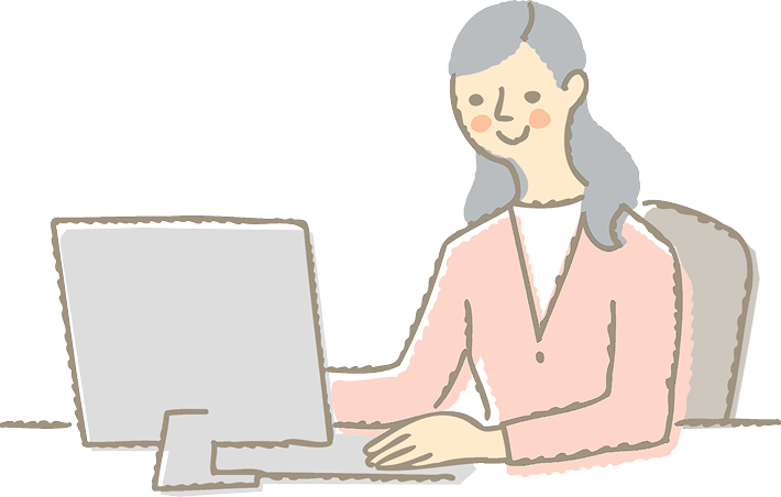 女性がコンピュータの前で作業しているシーンです。